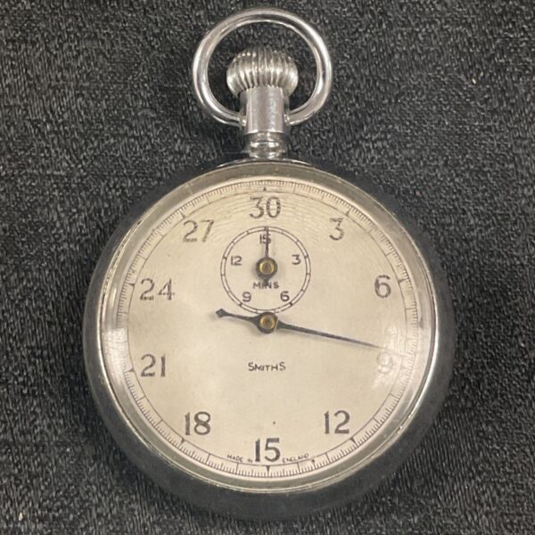 Vintage Smiths stopwatch with white dial and silver case.
