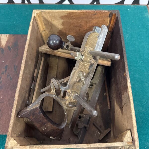 Vintage Stanley woodworking planes, antique hand tools for carpentry.