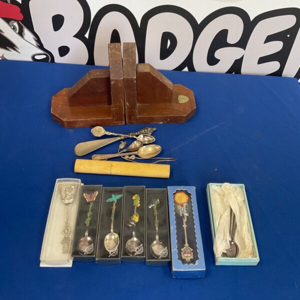 Vintage teaspoon and bookend lot, antique silverware collection.