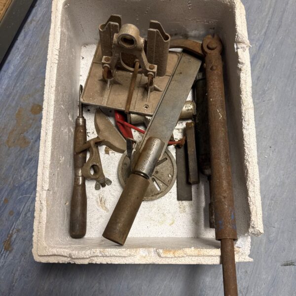 Vintage tool lot with metalworking implements and wooden handles.
