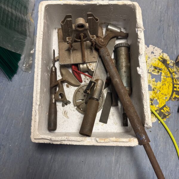 Vintage tool lot on a tray, antique metalworking implements.
