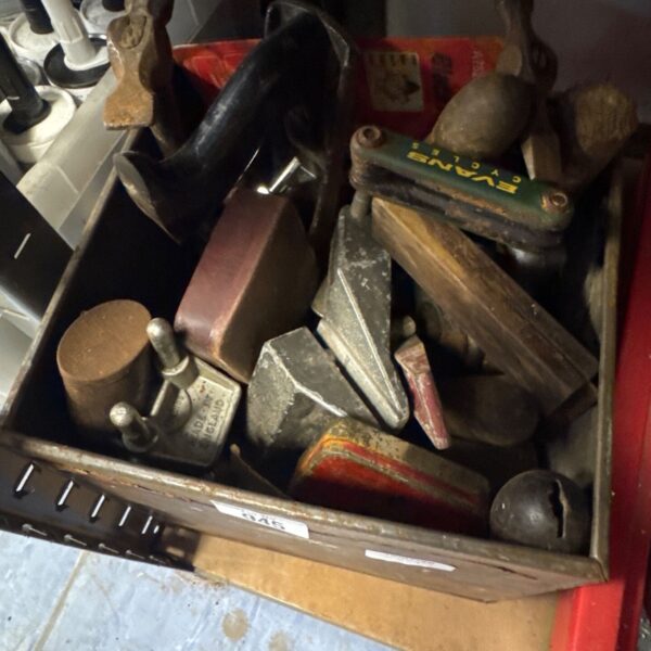 Vintage tools lot featuring a wood plane and other workshop implements.
