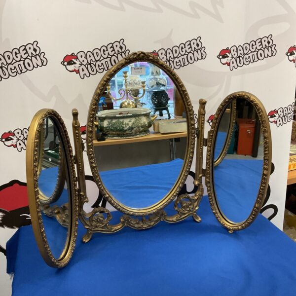 Vintage tri-fold dressing table mirror with gold frame.