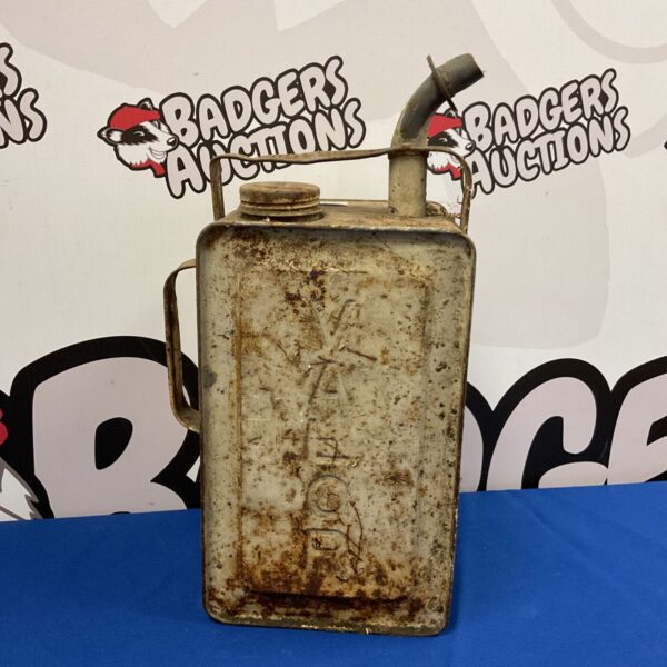 Vintage Valor fuel can with cap and spout, showing wear.