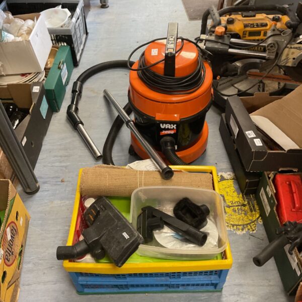 Vintage Vax 2000 cylinder vacuum cleaner with attachments.