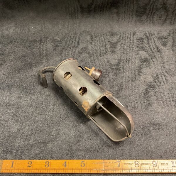 Vintage vehicle inspection lamp with metal housing and handle.