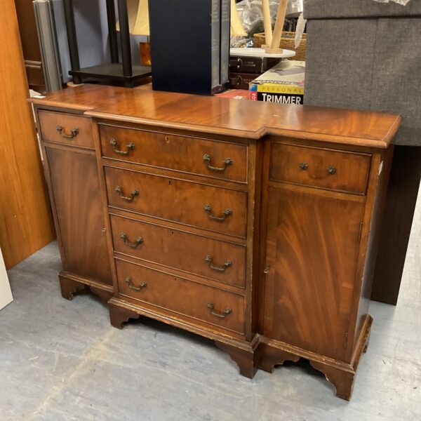 Vintage walnut console table with three drawers for storage.