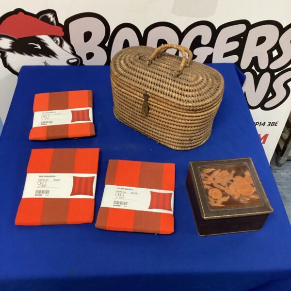 Vintage wicker basket and embossed jewellery box with Ikea cushion covers.