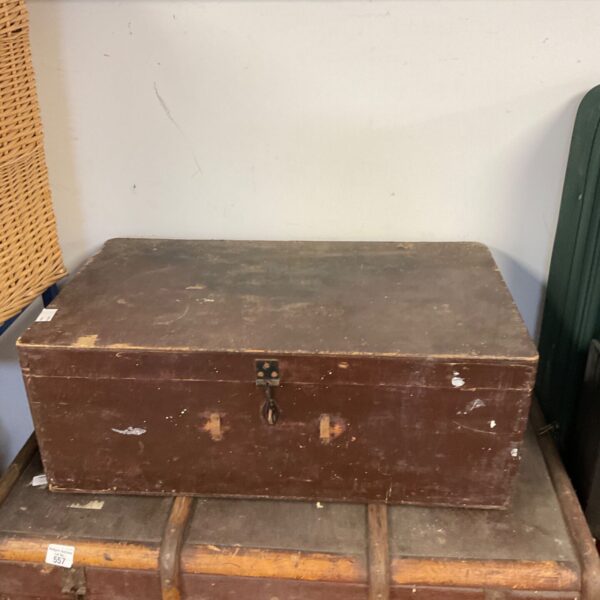 Vintage wooden chest with metal clasp, ideal for storage and rustic decor.