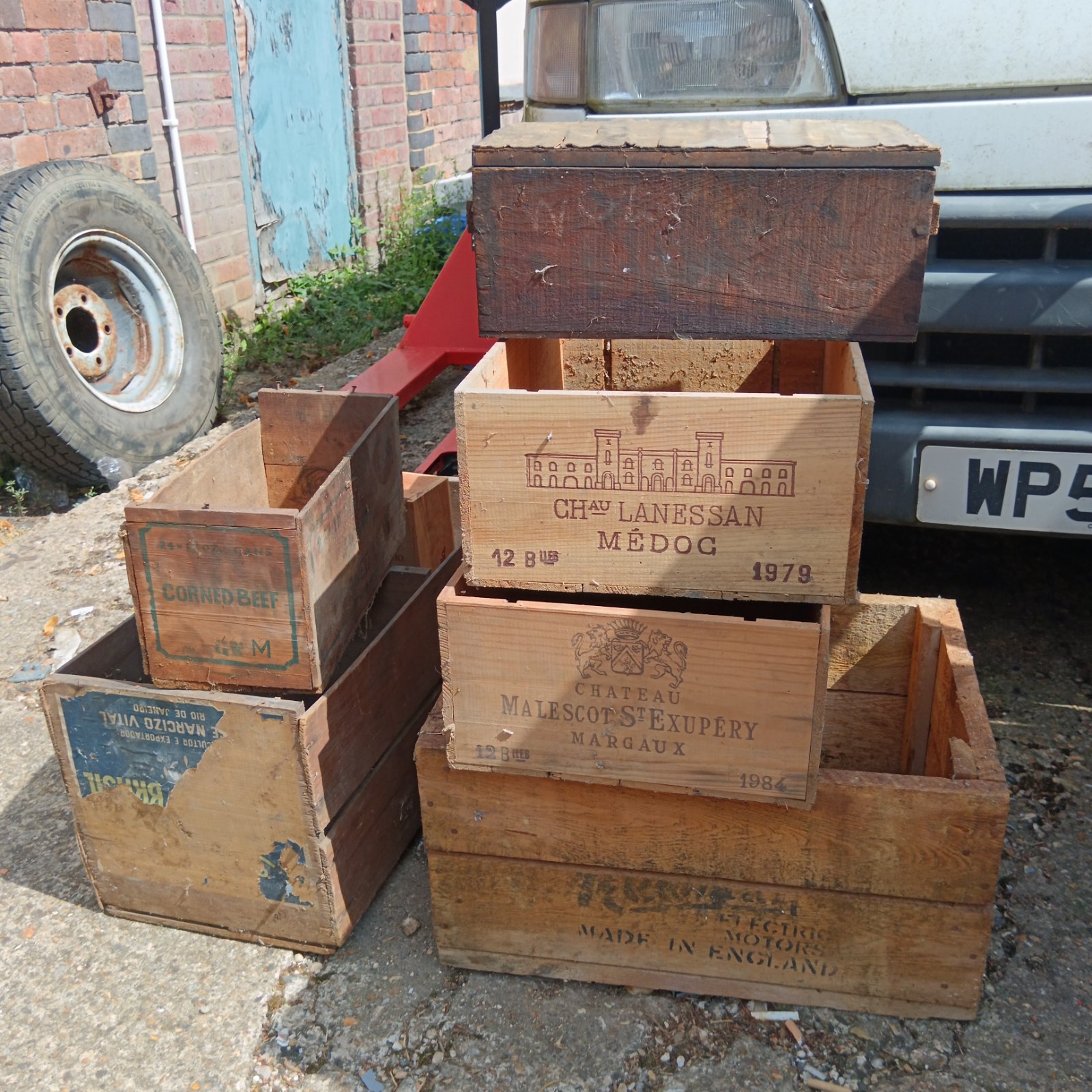 Vintage wooden crates including corned beef and champagne boxes.