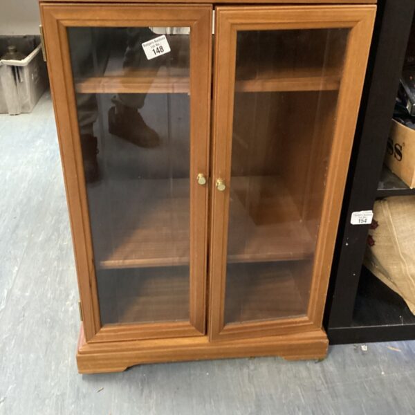 Vintage wooden hifi unit with open shelving for audio equipment.