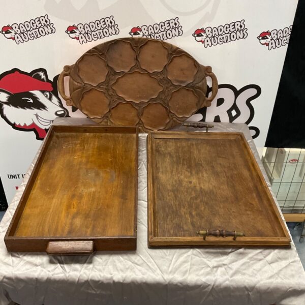 Vintage wooden serving trays with handles, rustic kitchen decor.