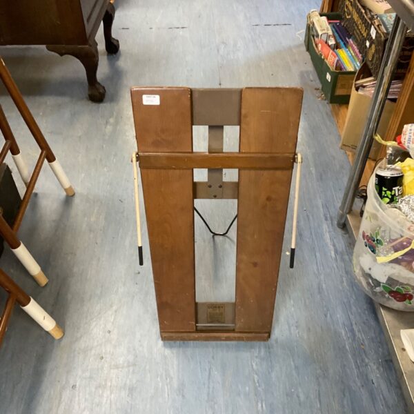 Vintage wooden trouser press for keeping trousers creased.