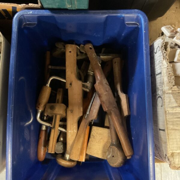 Vintage woodworking tools collection with wooden handles.