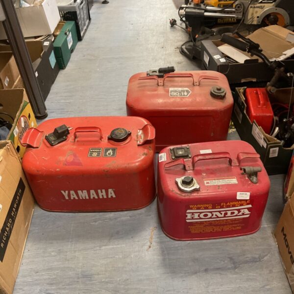 Vintage Yamaha and Honda outboard fuel tanks for boat motors.