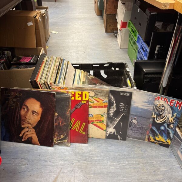 Vinyl LP collection featuring artists like Bob Marley and Iron Maiden.