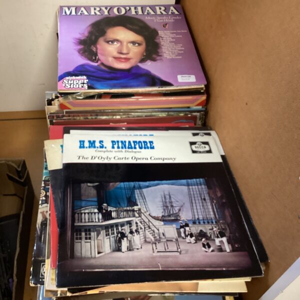 Stack of vintage vinyl records including Mary O’Hara album.