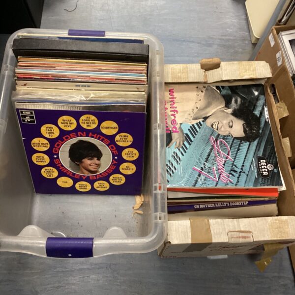 Vintage vinyl records lot featuring Shirley Bassey and Winifred Atwell albums.
