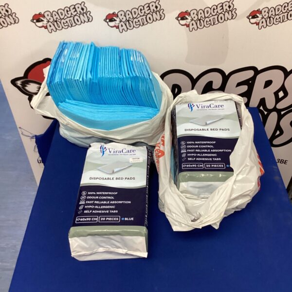 Lot of Viracare disposable bed pads for incontinence protection.