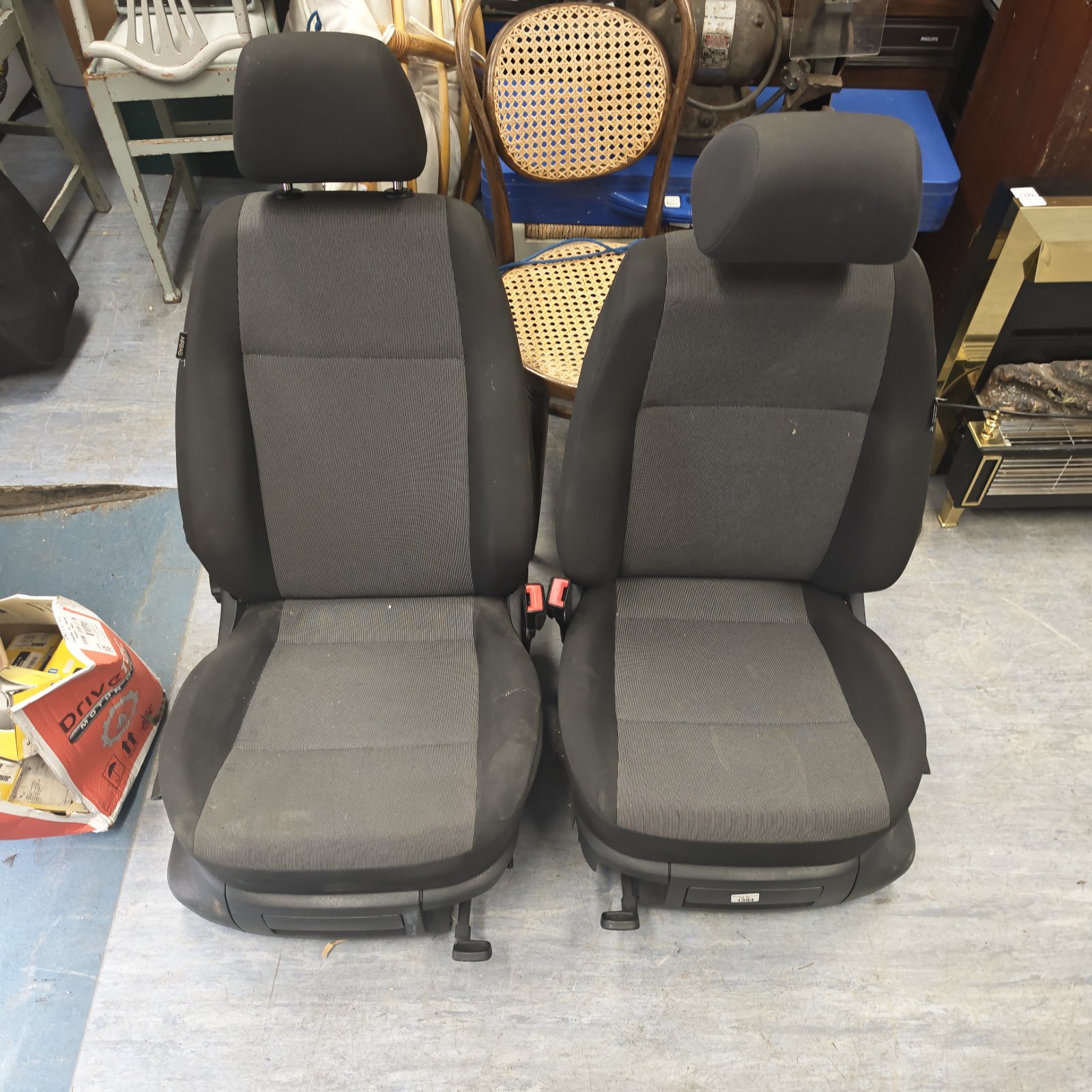 Used VW Caddy seats pair with black fabric upholstery.