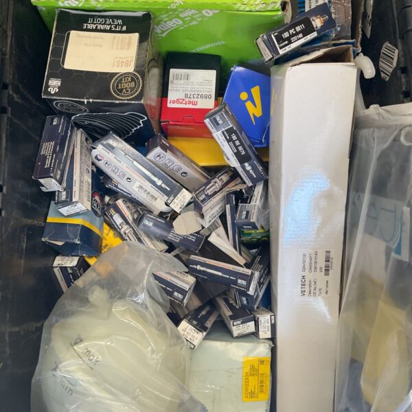 Crate of assorted Volkswagen car parts and auto spares.