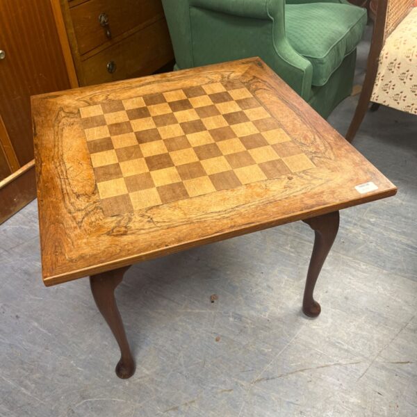 Vintage walnut table with checkerboard inlay and cabriole legs.