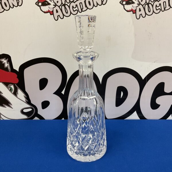 Elegant Waterford crystal decanter with intricate cuts, perfect for barware.