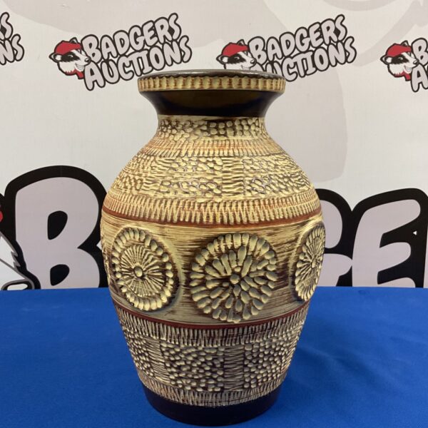Vintage West German pottery vase with floral design.