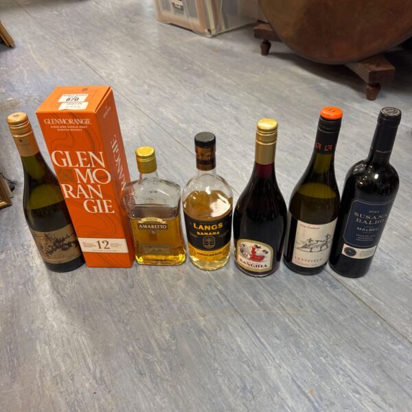Selection of sealed whiskey and wine bottles from house clearance.