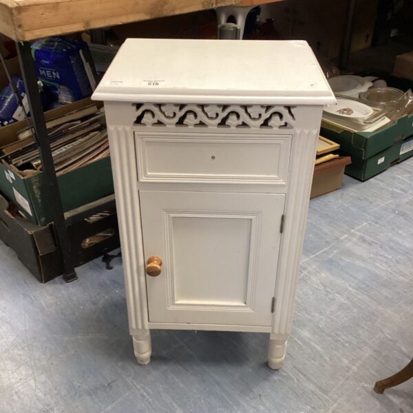 White bedside cabinet with a single drawer, vintage bedroom furniture.