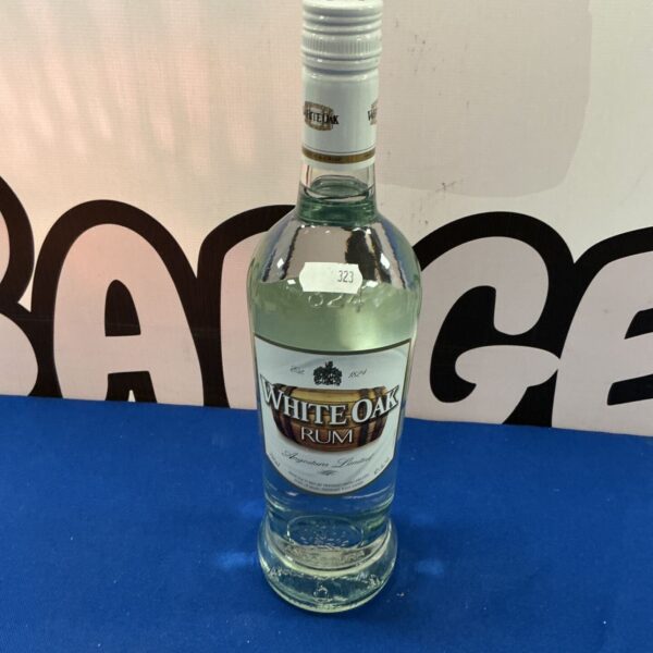 White Oak Rum bottle presented for auction, collectible spirits.