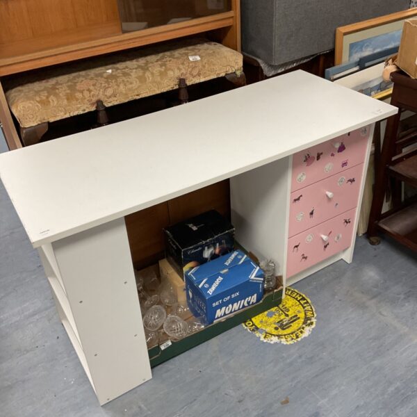 White and pink child's desk with three drawers, vintage style.
