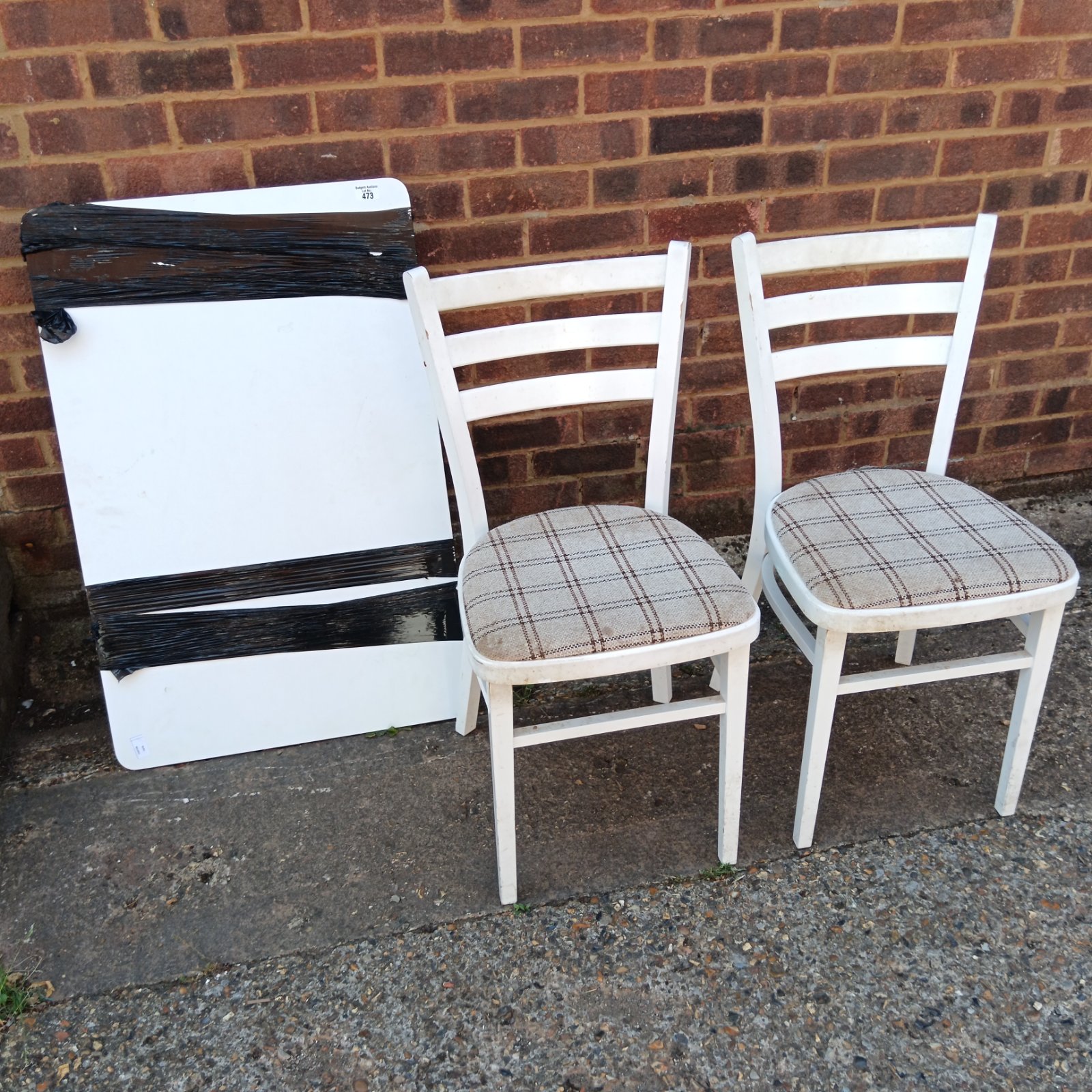 Vintage white table and two chairs with checkered seats.