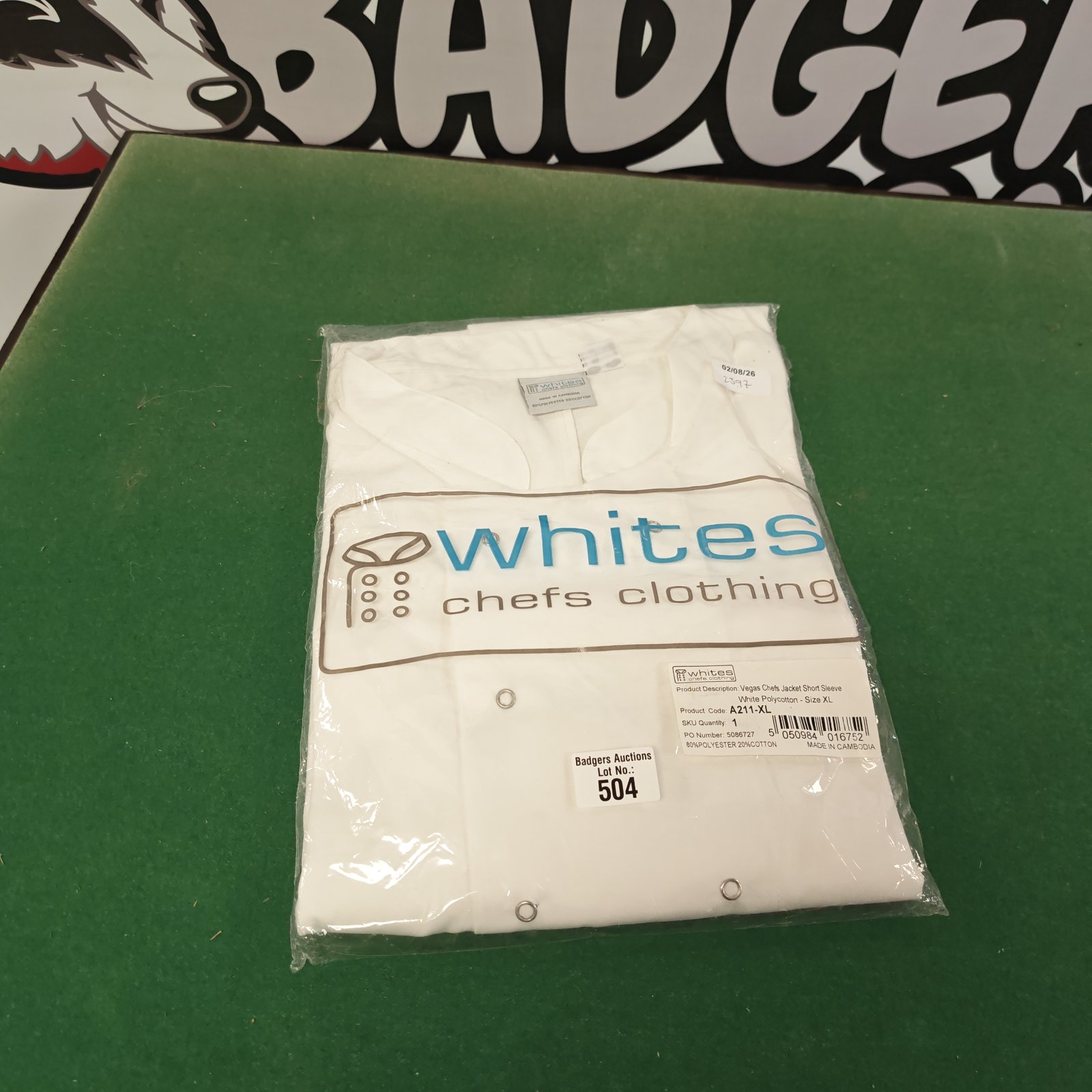 White XL chef jacket, short sleeve, professional culinary wear.