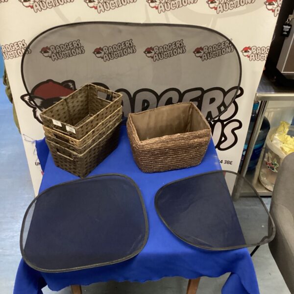 Wicker baskets and car sun shades lot for storage and summer protection.