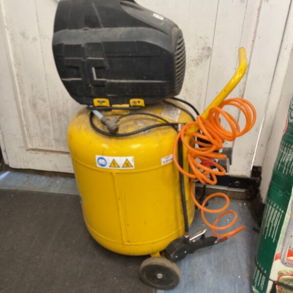 Wolh Air portable air compressor with hose and wheels.