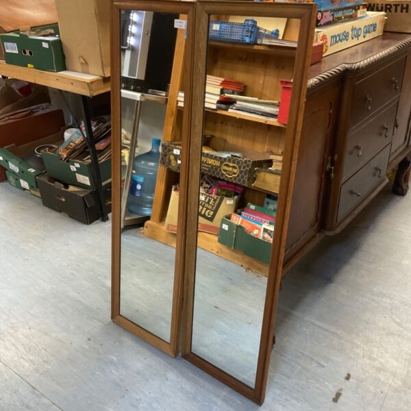 Pair of vintage wood framed mirrors for home decor.