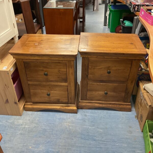 Pair of vintage wooden bedside drawers with handles.