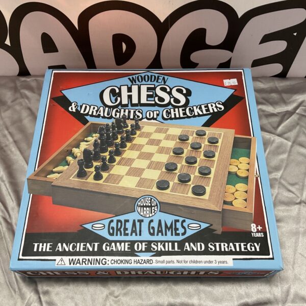 Vintage wooden chess, draughts and checkers set with folding board.