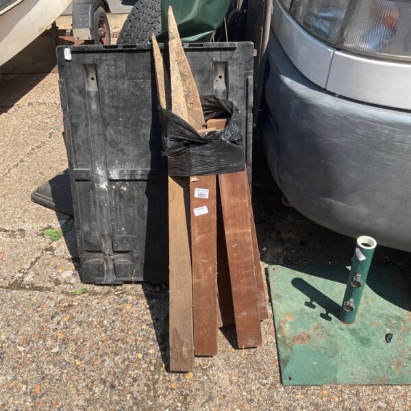 Lot of eight weathered wooden fence posts for garden use.