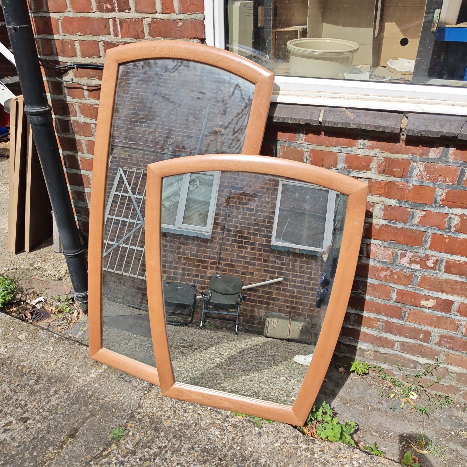 Vintage wooden framed arched wall mirror for home decor.