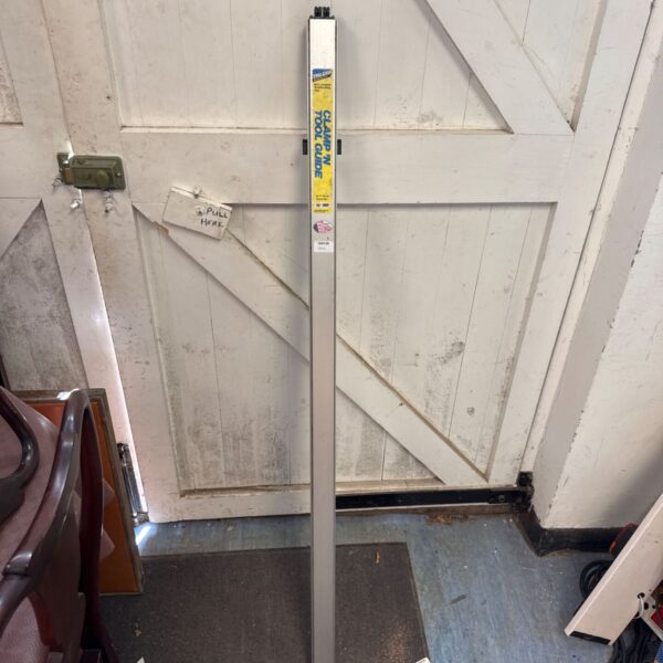 Tru-Grip woodworking clamp guide leaning against a door.