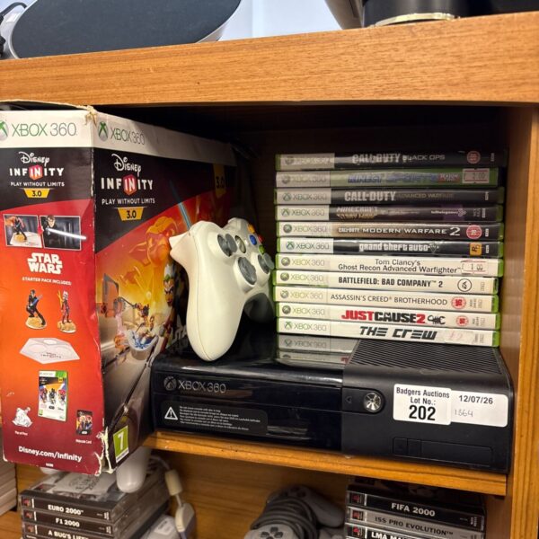 Xbox 360 E console bundle with Disney Infinity and various games.