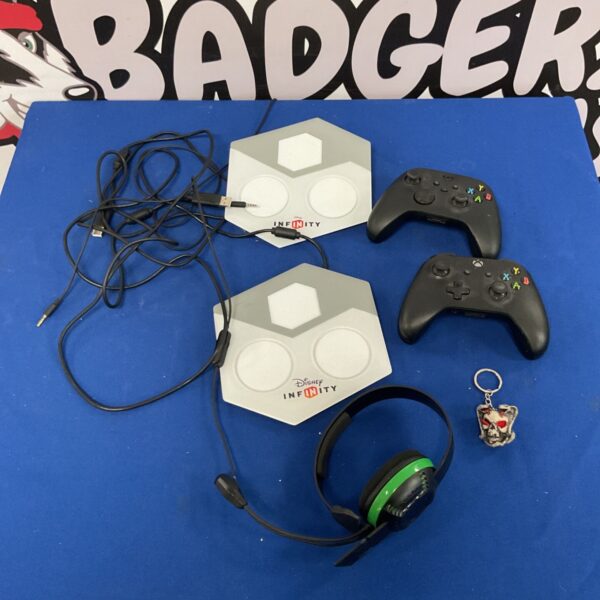 Xbox gaming bundle featuring controllers, Disney Infinity pads, and a headset.