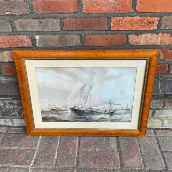 Vintage nautical print of yacht America clipper ship in maple frame.