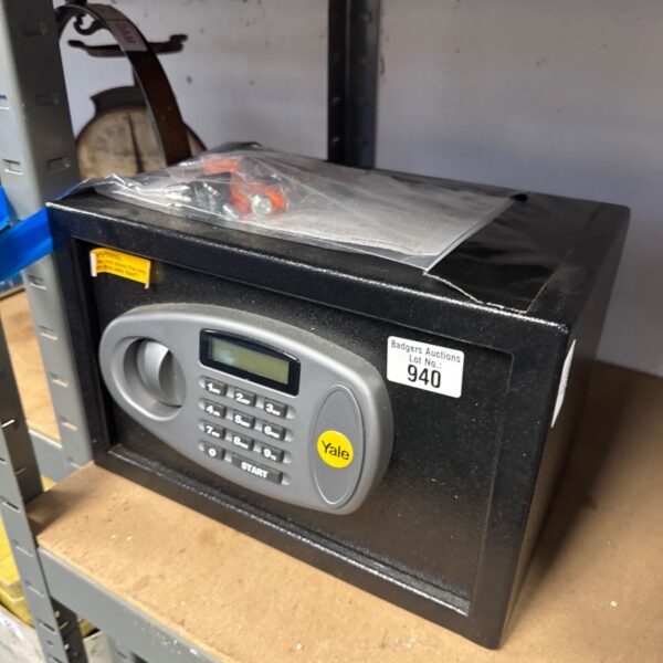 Yale safe with keys, a vintage home security item.
