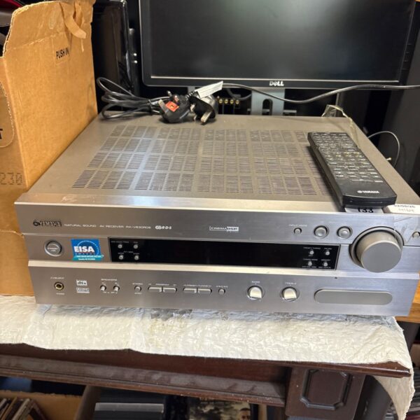 Yamaha RX-V63RDS AV receiver with remote control, vintage audio equipment.