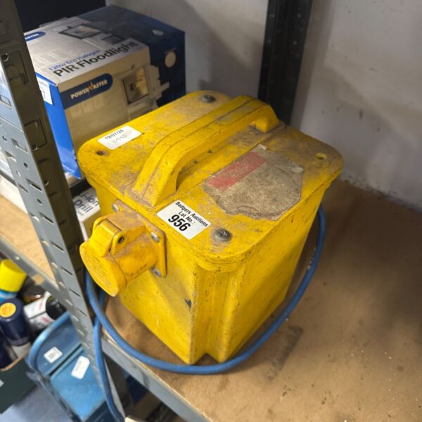 Yellow site transformer for construction and electrical work.