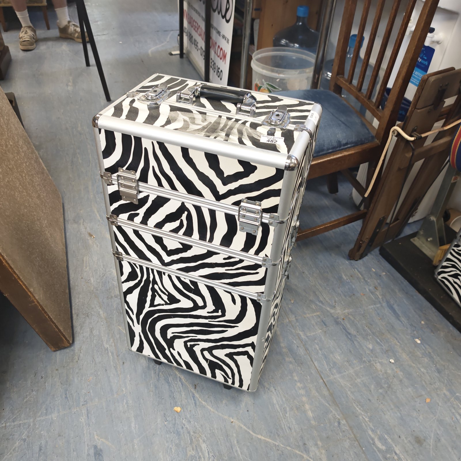 Zebra print makeup artist case with silver accents.