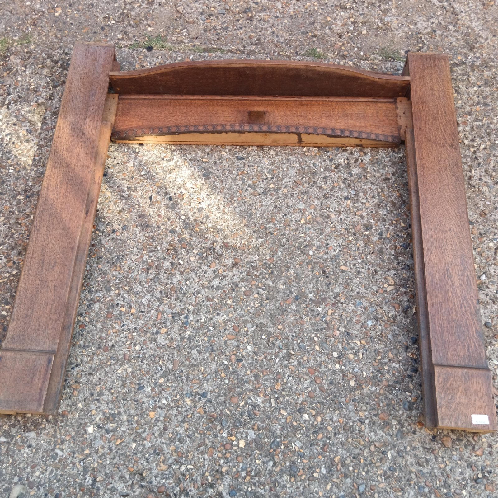 Vintage 1930s oak fireplace surround with curved mantelpiece.